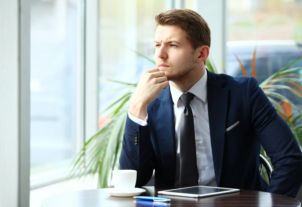 a man thinking about what examples of gross misconduct at work are