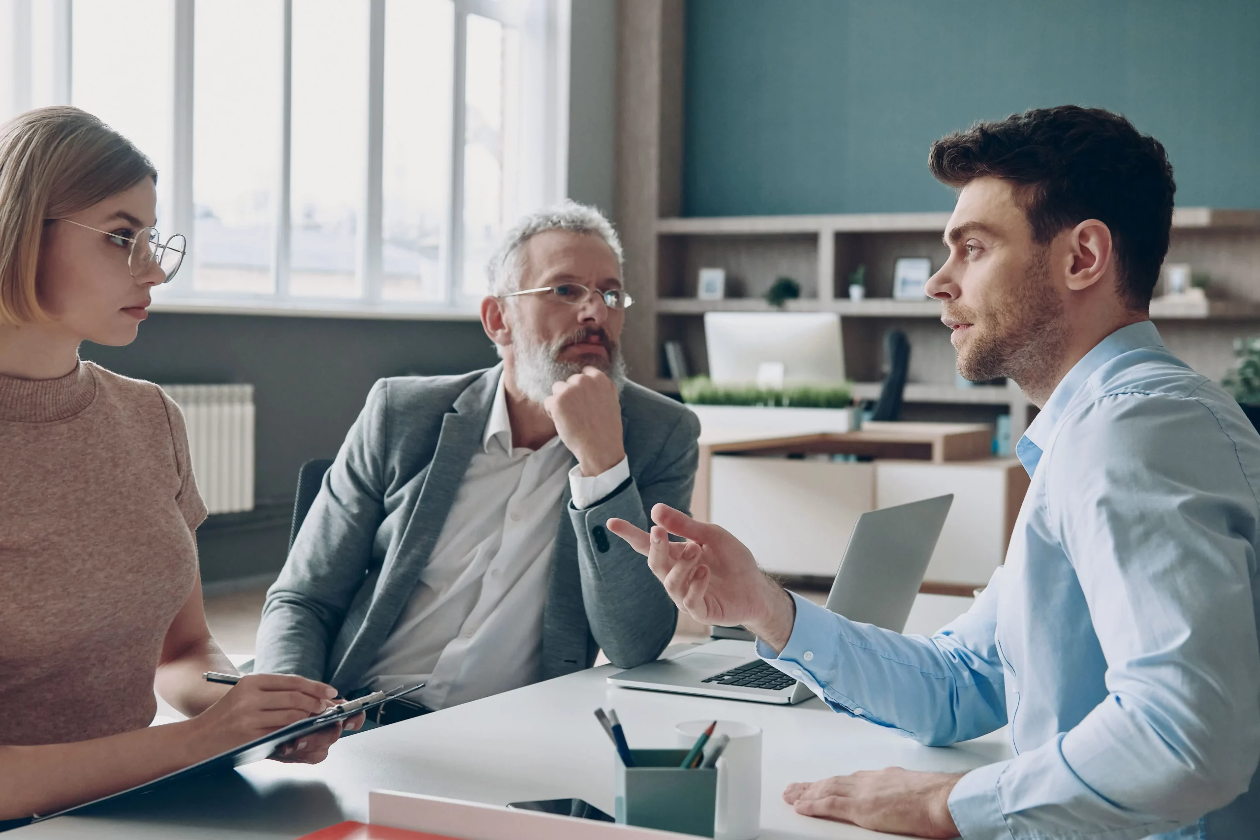 An Emberscale HR consultant supporting a client after asking "how do I dismiss an employee?", guiding a compassionate and compliant dismissal meeting.