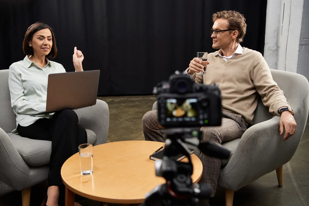 two directors discussing a live business update using a corporate videographer