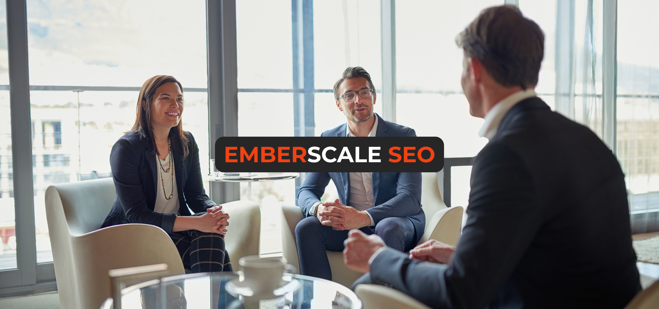 Professional SEO consultants discussing strategies with client in modern office meeting