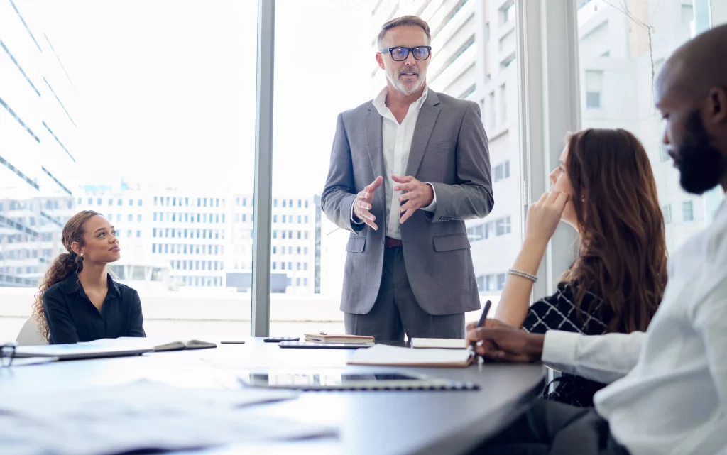 SEO agency expert leading a client consultation on SEO services in a modern high-rise office