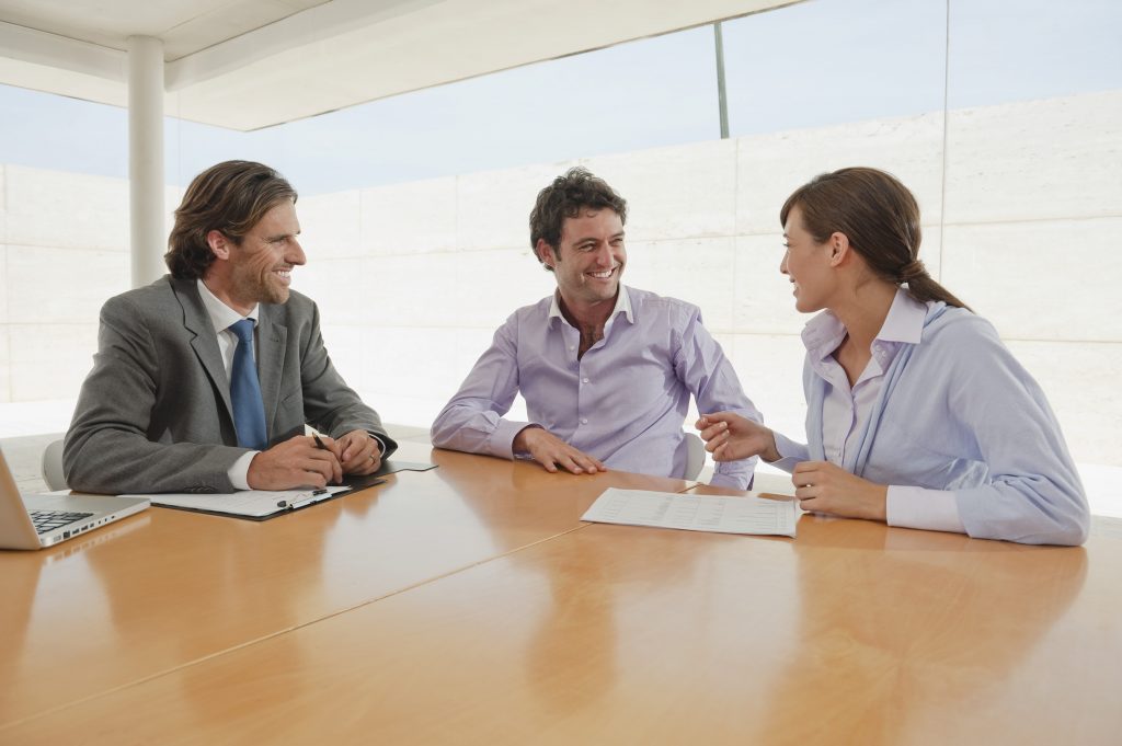 three employees talking about their new rights due to employment law changes in 2026